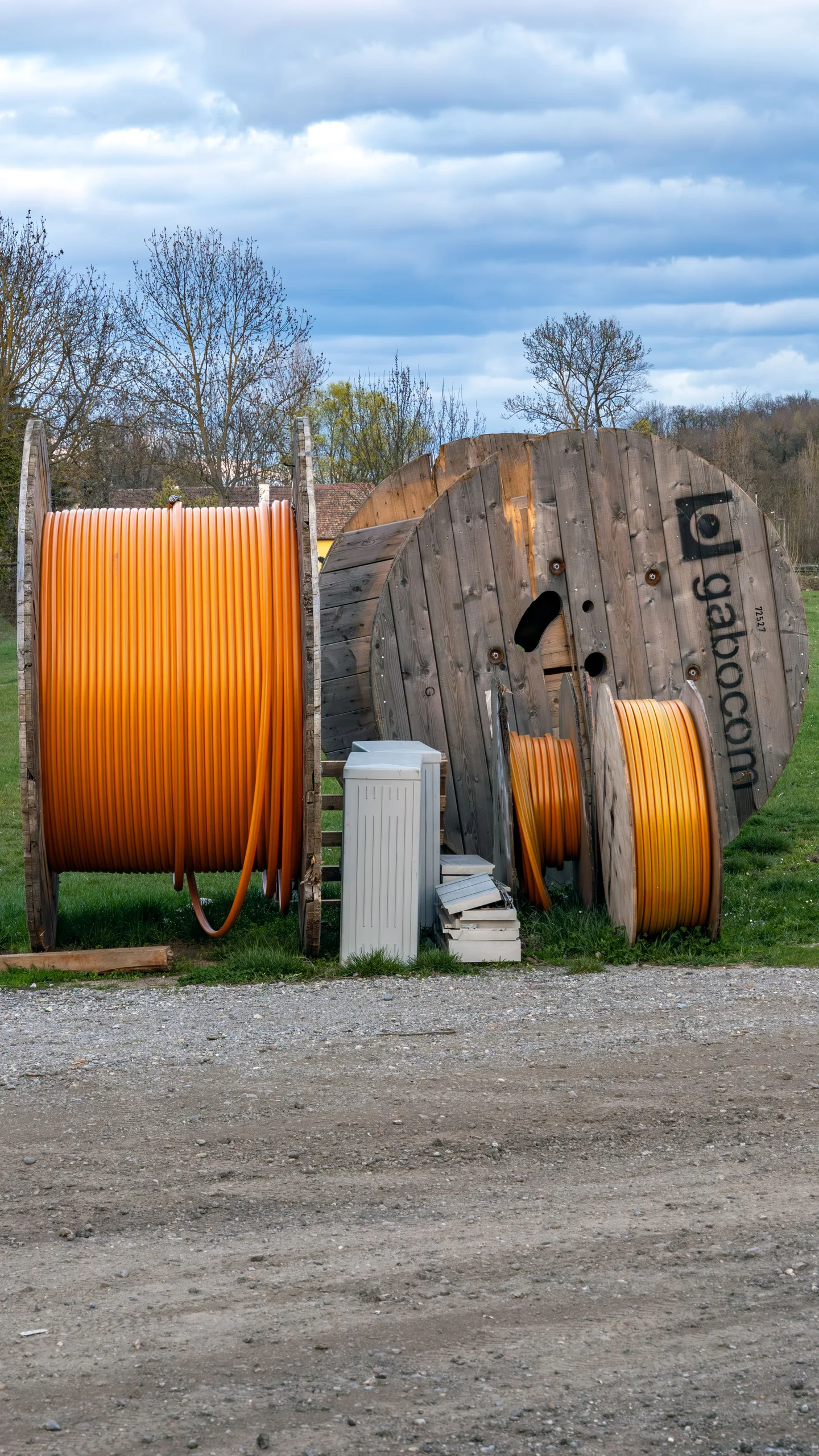 Orange fibre ducts and cable reels at a backbone project site