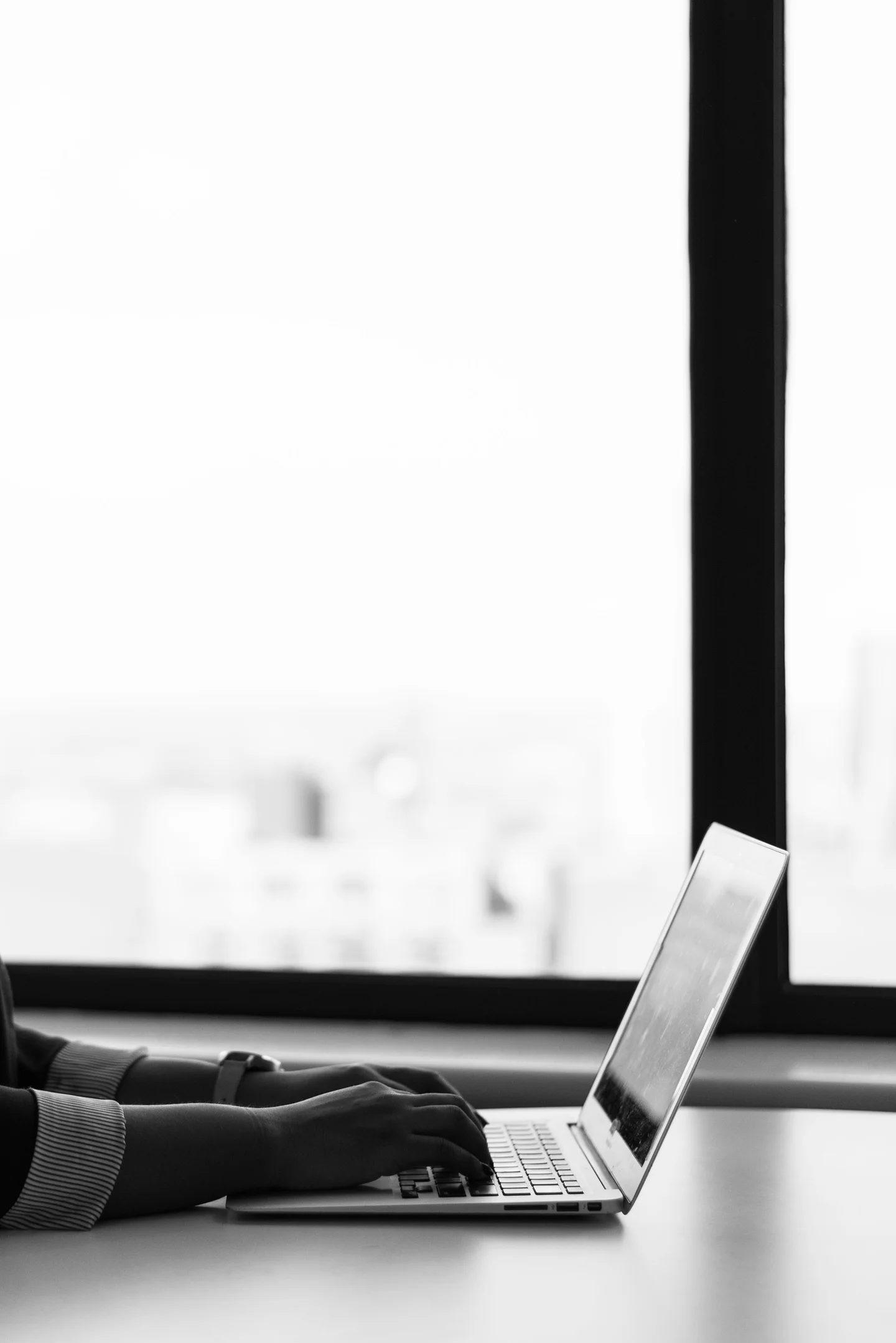 Professional working on enterprise software at a laptop