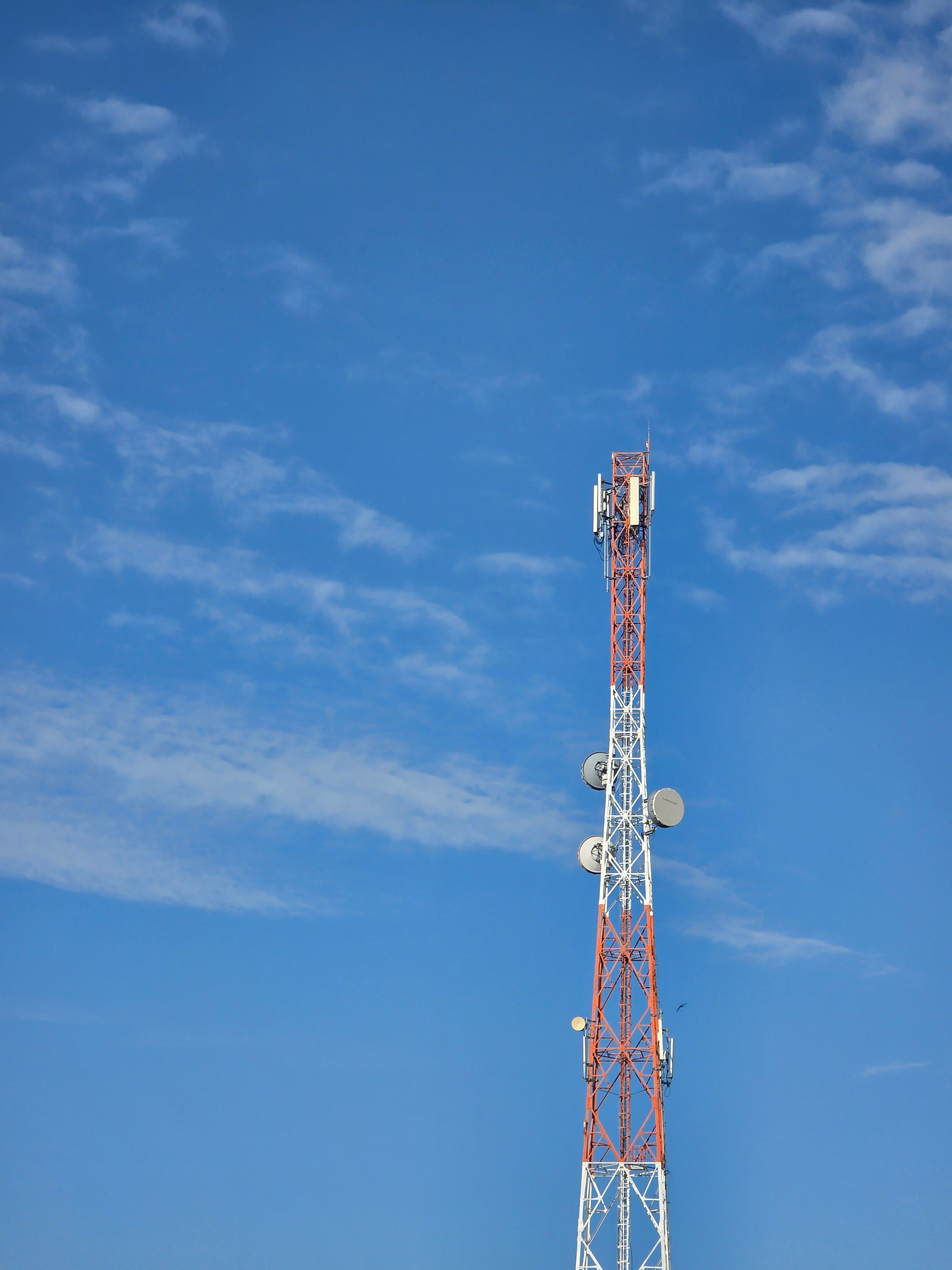 Telecommunications tower against a blue sky