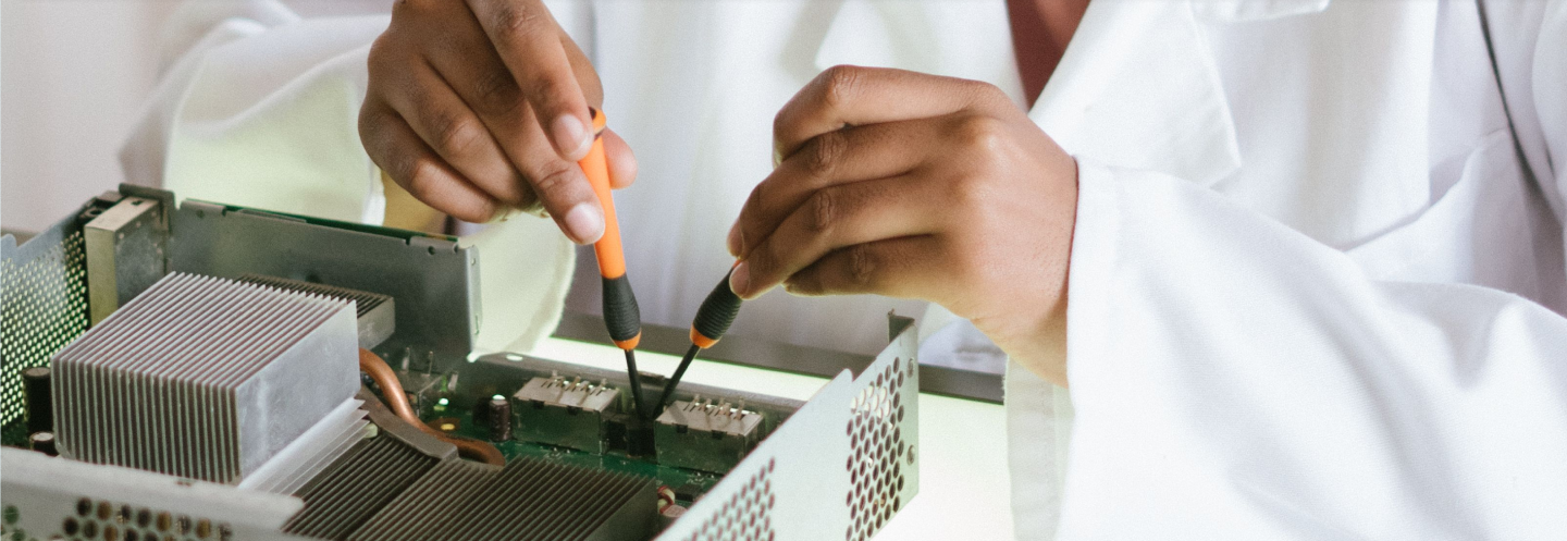 Technician working on electronic equipment